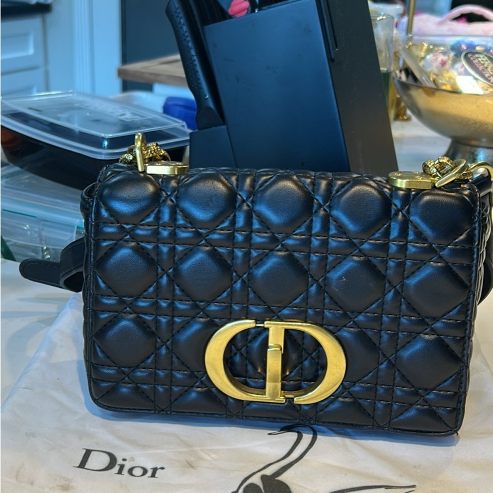 Elegant Black Quilted Crossbody Bag with Gold Details